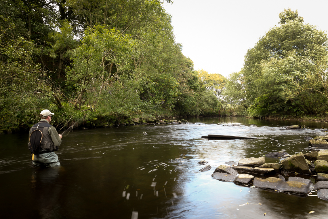 Jonathan Hoyle fishing the weir above Copley Bridge, River Calder near Halifax