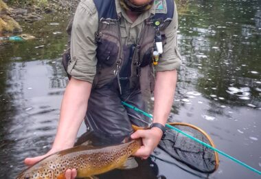 Jonathan Hoyle with big wild river trout